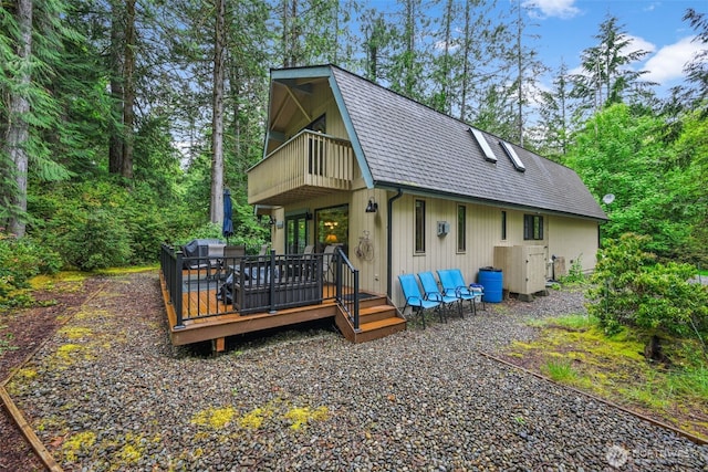 436 E Pointes Dr E, Shelton, WA 98584 - rear view of property featuring a balcony, a gambrel roof, and a deck