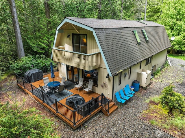 436 E Pointes Dr E, Shelton, WA 98584 - back of house with a gambrel roof, a shingled roof, french doors, and a deck