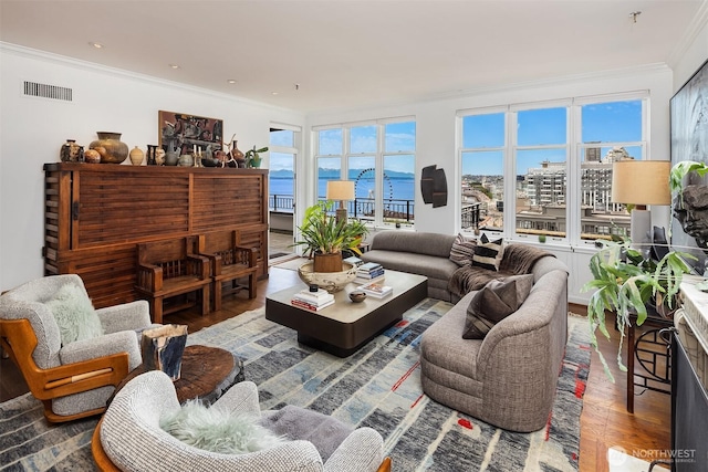 1009 Western Ave Unit 1203, Seattle, WA 98104 - living room featuring ornamental molding, wood finished floors, and a view of city