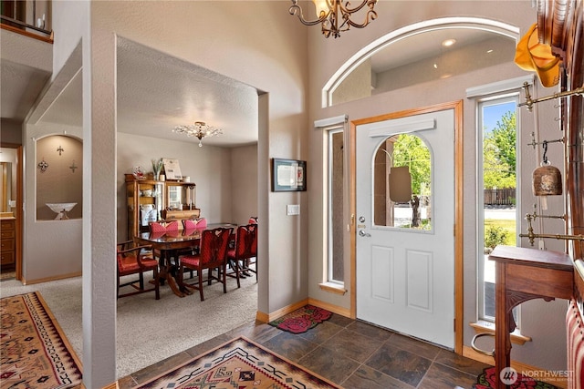 2541 Fancher Heights Blvd, East Wenatchee, WA 98802 - entryway featuring a chandelier and baseboards