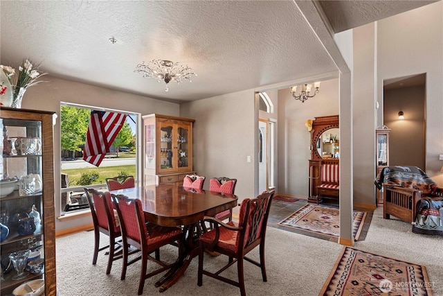 2541 Fancher Heights Blvd, East Wenatchee, WA 98802 - dining area featuring a chandelier, a textured ceiling, and carpet