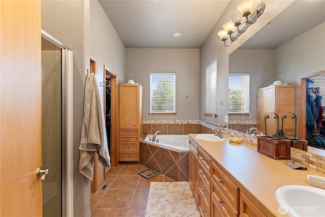 2541 Fancher Heights Blvd, East Wenatchee, WA 98802 - full bath with tile patterned floors, a stall shower, a garden tub, double vanity, and a closet