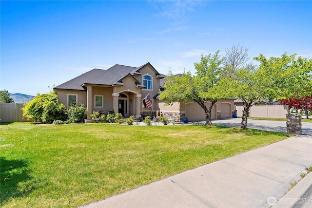 2541 Fancher Heights Blvd, East Wenatchee, WA 98802 - view of front of property featuring stucco siding, driveway, an attached garage, and a shingled roof