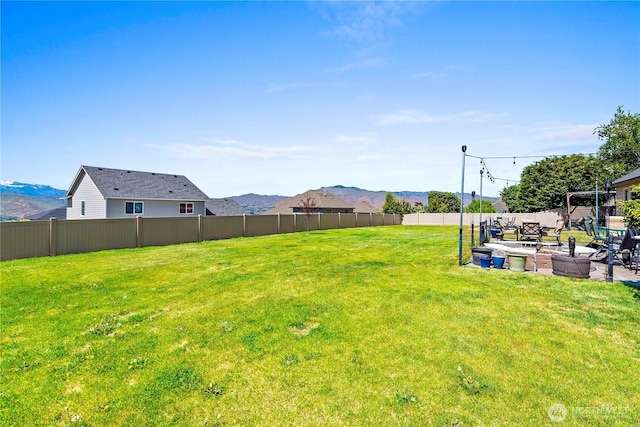 2541 Fancher Heights Blvd, East Wenatchee, WA 98802 - view of yard with a patio and a mountain view