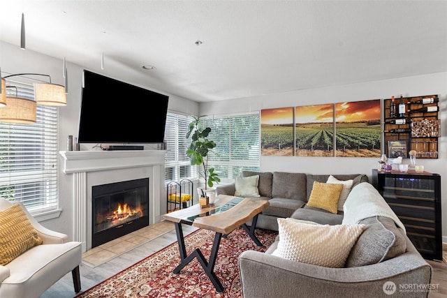 3908 243rd Pl SE Unit Q-203, Bothell, WA 98021 - living room featuring plenty of natural light and a glass covered fireplace