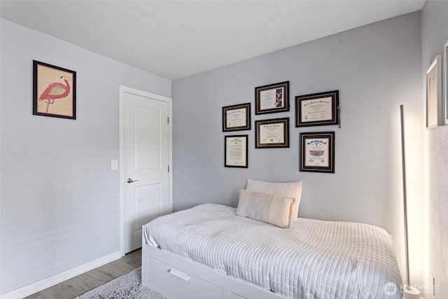 3908 243rd Pl SE Unit Q-203, Bothell, WA 98021 - bedroom with wood finished floors and baseboards
