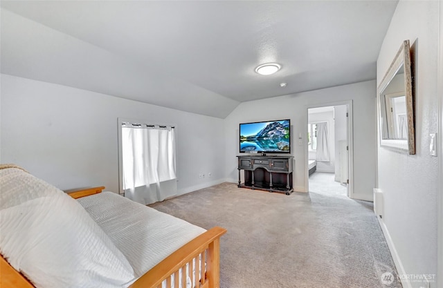 612 Hunt Ave, Sumner, WA 98390 - bedroom featuring lofted ceiling, baseboards, and light carpet