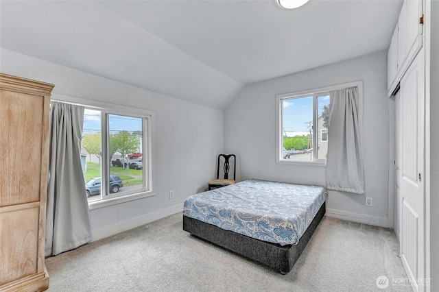 612 Hunt Ave, Sumner, WA 98390 - bedroom with lofted ceiling, baseboards, and light colored carpet