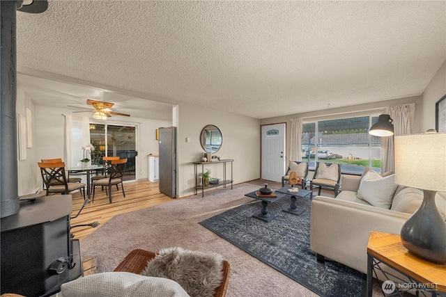 7052 S I St, Tacoma, WA 98408 - living area with a textured ceiling and ceiling fan