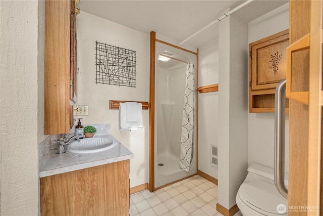 7052 S I St, Tacoma, WA 98408 - full bath featuring a shower stall, vanity, and baseboards