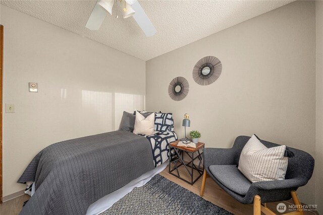 7052 S I St, Tacoma, WA 98408 - bedroom with wood finished floors, a ceiling fan, and a textured ceiling