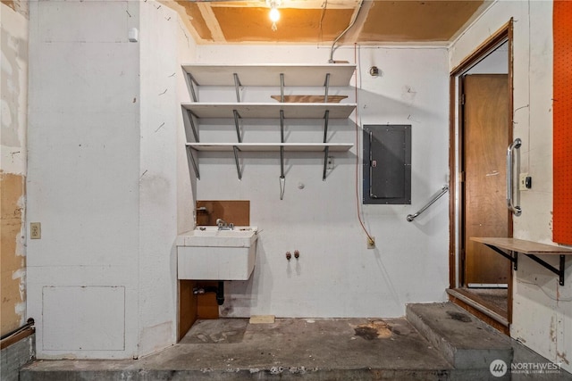 7052 S I St, Tacoma, WA 98408 - kitchen with electric panel, unfinished concrete flooring, and a sink