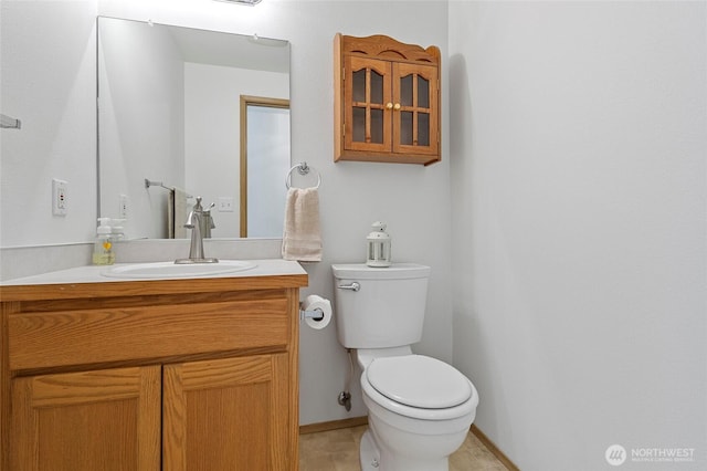 1274 Admirals Dr, Coupeville, WA 98239 - bathroom featuring toilet, vanity, baseboards, and tile patterned floors
