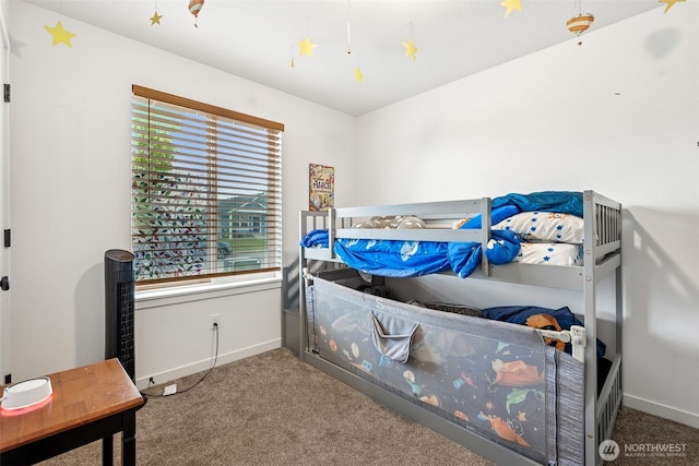 carpeted bedroom with baseboards