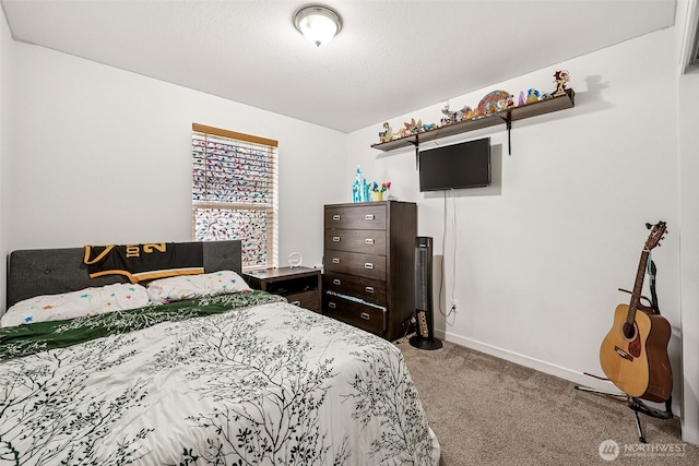 carpeted bedroom with baseboards