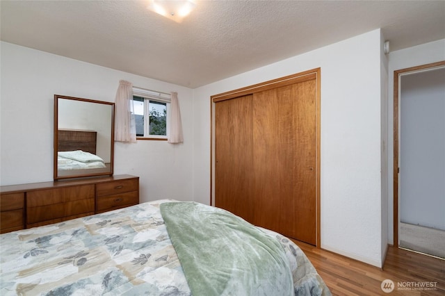 2129 H Ave, Anacortes, WA 98221 - bedroom featuring wood finished floors and a closet