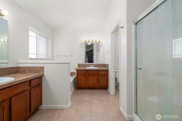 18910 SE 41st Dr, Vancouver, WA 98683 - full bath featuring tile patterned floors, lofted ceiling, a stall shower, vanity, and toilet