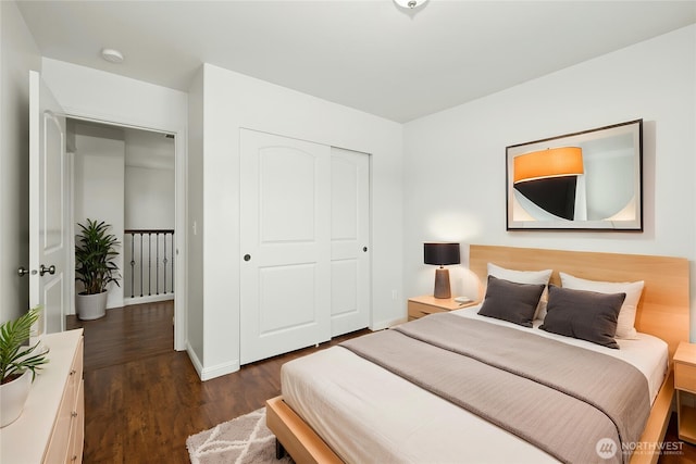 18910 SE 41st Dr, Vancouver, WA 98683 - bedroom with dark wood-type flooring, a closet, and baseboards
