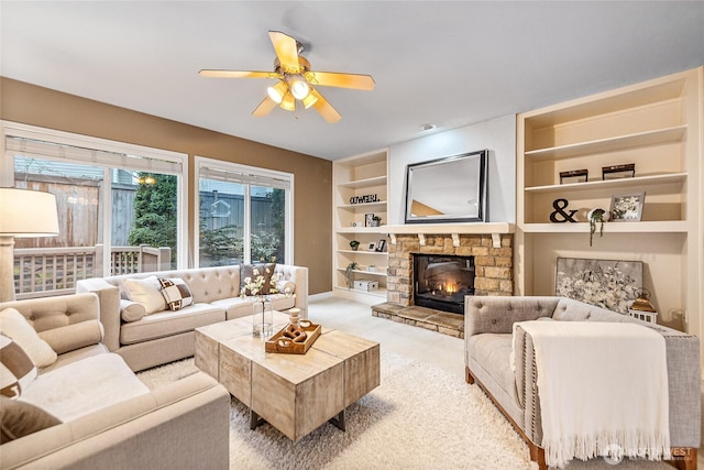 908 274th Way SE, Sammamish, WA 98075 - living area featuring light colored carpet, built in features, a ceiling fan, a fireplace, and baseboards