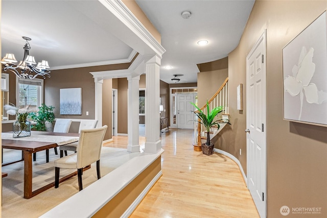908 274th Way SE, Sammamish, WA 98075 - entryway featuring light wood-type flooring, decorative columns, a chandelier, baseboards, and crown molding