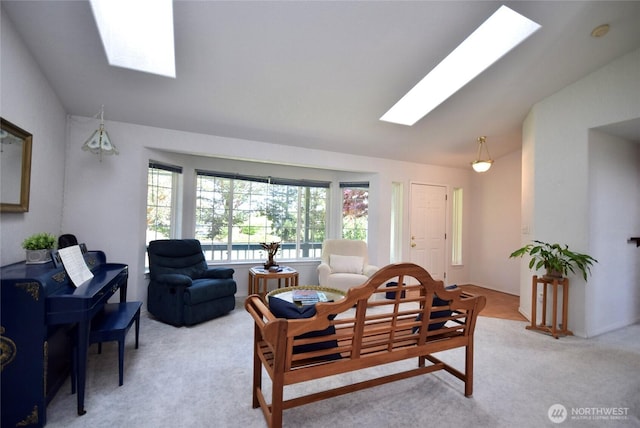 living room featuring a skylight, lofted ceiling, and light carpet