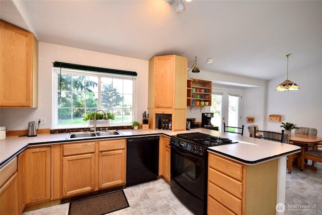 kitchen featuring black appliances, a sink, a peninsula, and light brown cabinetry