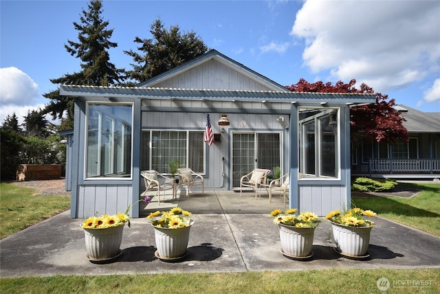 rear view of house featuring a patio and a pergola