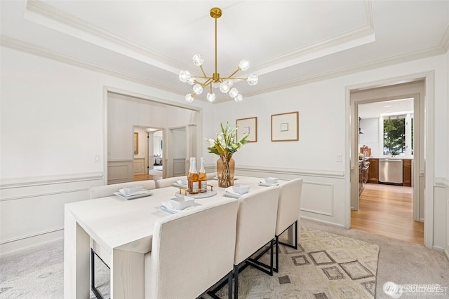 9416 NE 25th St, Clyde Hill, WA 98004 - dining room featuring crown molding, a decorative wall, a raised ceiling, a chandelier, and a wainscoted wall