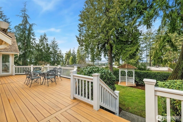 9416 NE 25th St, Clyde Hill, WA 98004 - deck with outdoor dining space, a gazebo, and a lawn