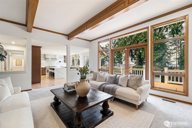 9416 NE 25th St, Clyde Hill, WA 98004 - living room featuring beam ceiling, ornamental molding, baseboards, and french doors