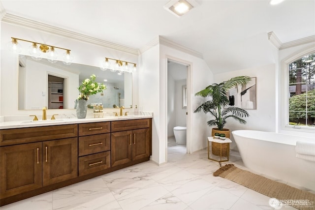 9416 NE 25th St, Clyde Hill, WA 98004 - full bath with double vanity, a freestanding tub, toilet, marble finish flooring, and ornamental molding