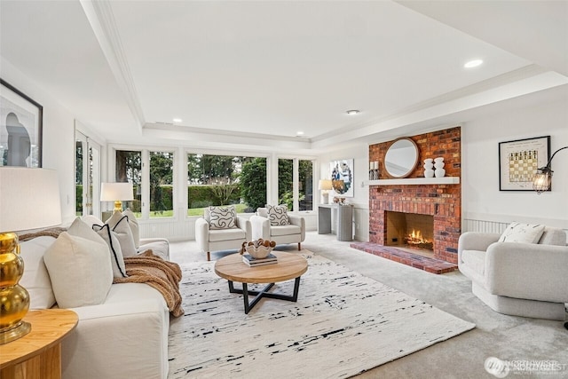 9416 NE 25th St, Clyde Hill, WA 98004 - living room featuring a tray ceiling, a brick fireplace, recessed lighting, and ornamental molding