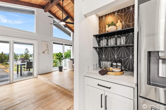 4950 N Lexington St, Tacoma, WA 98407 - bar featuring stainless steel fridge with ice dispenser, wooden ceiling, healthy amount of natural light, and light wood-style floors