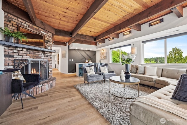 4950 N Lexington St, Tacoma, WA 98407 - living area featuring light wood-type flooring, wood ceiling with exposed beams, and a fireplace