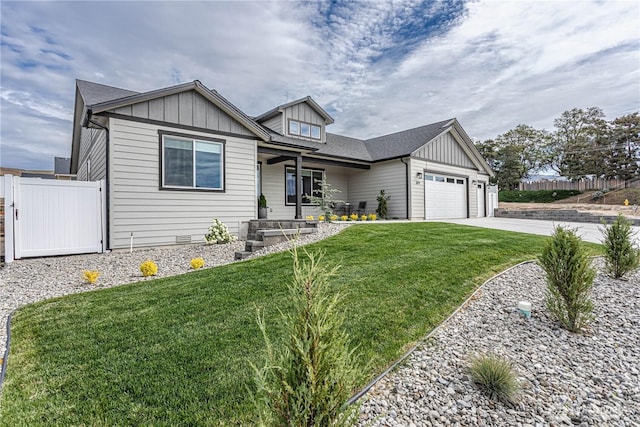 819 N Newport Loop, East Wenatchee, WA 98802 - view of front facade featuring board and batten siding, a garage, a porch, and driveway