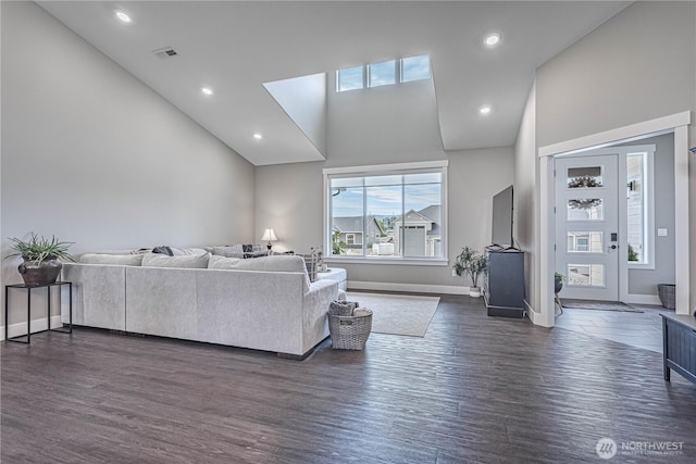 819 N Newport Loop, East Wenatchee, WA 98802 - living room with dark wood-style flooring, baseboards, recessed lighting, and high vaulted ceiling