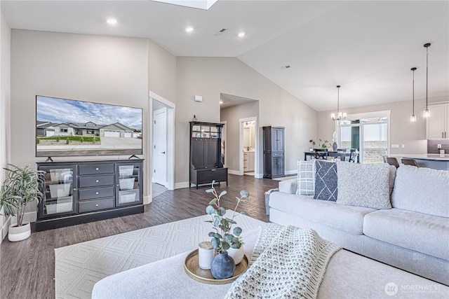 819 N Newport Loop, East Wenatchee, WA 98802 - living room with dark wood finished floors, baseboards, a chandelier, high vaulted ceiling, and recessed lighting