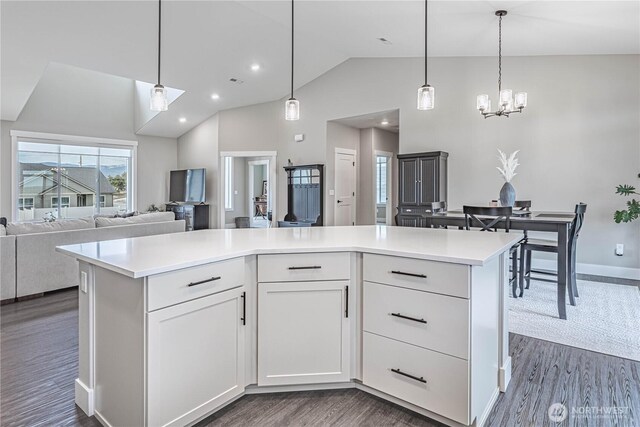819 N Newport Loop, East Wenatchee, WA 98802 - kitchen featuring open floor plan, dark wood-style flooring, white cabinetry, a chandelier, and recessed lighting