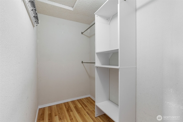 walk in closet featuring light wood-type flooring