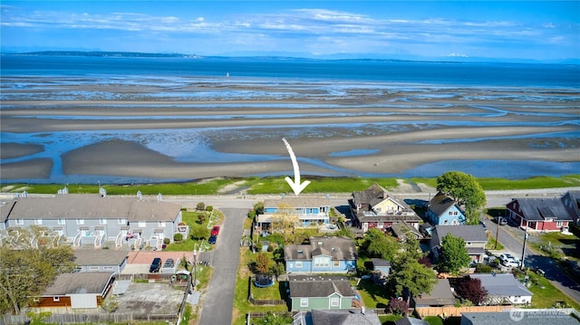 aerial view of residential area featuring a nearby body of water