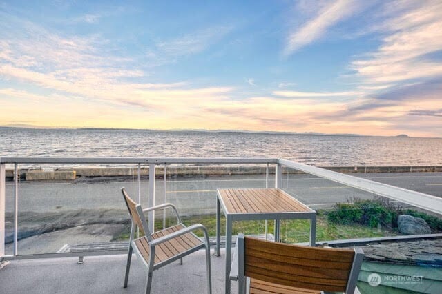 balcony at dusk with a water view