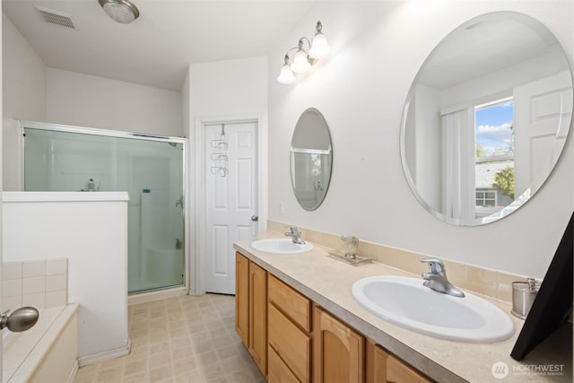 full bathroom with a shower stall, a garden tub, and double vanity