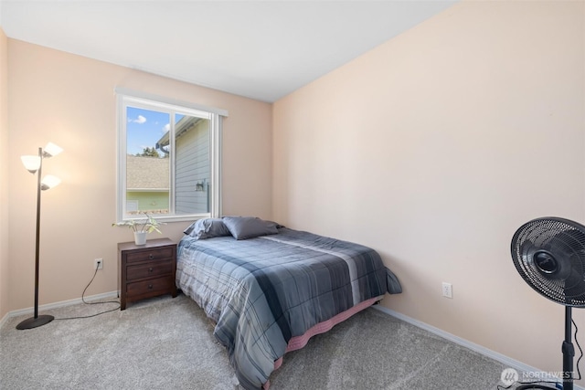 bedroom featuring carpet flooring and baseboards