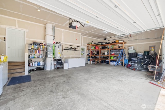 garage featuring gas water heater and a garage door opener