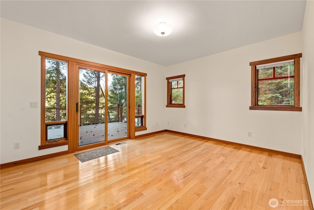 244 Davison Head Dr, Friday Harbor, WA 98250 - empty room featuring plenty of natural light, light wood-type flooring, and baseboards