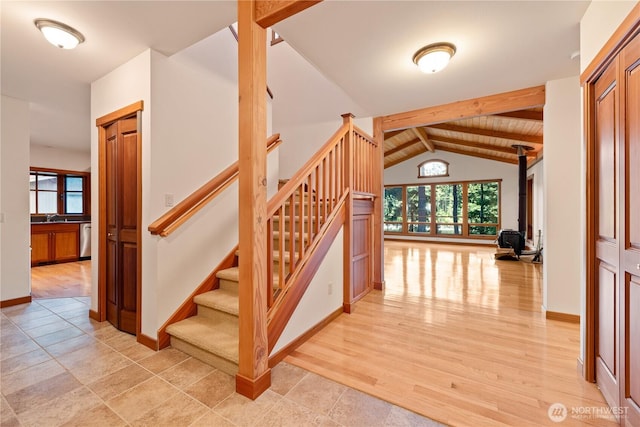 244 Davison Head Dr, Friday Harbor, WA 98250 - staircase with healthy amount of natural light, wood finished floors, and baseboards