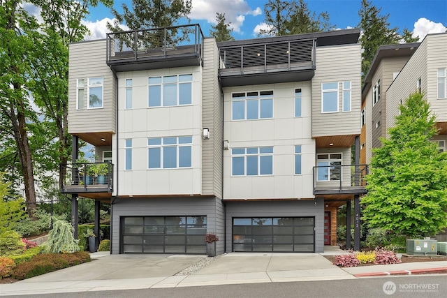 4012 129th Pl SE Unit 2, Bellevue, WA 98006 - view of front of home with a balcony, a garage, and central AC