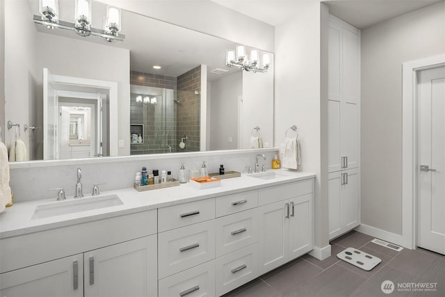 4012 129th Pl SE Unit 2, Bellevue, WA 98006 - full bath featuring a shower stall, double vanity, tile patterned flooring, a chandelier, and baseboards