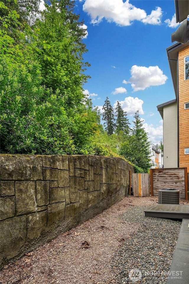 4012 129th Pl SE Unit 2, Bellevue, WA 98006 - view of yard featuring fence and central air condition unit