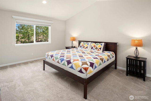 bedroom featuring carpet flooring, lofted ceiling, and baseboards